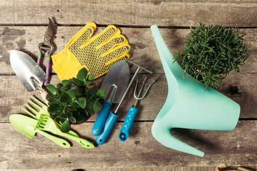 Gardener preparing hedge trimming equipment at the start of a job